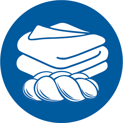 Icon of a blanket folder next to a loaf of Challah bread.